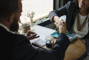 realtors shaking hands in agreement