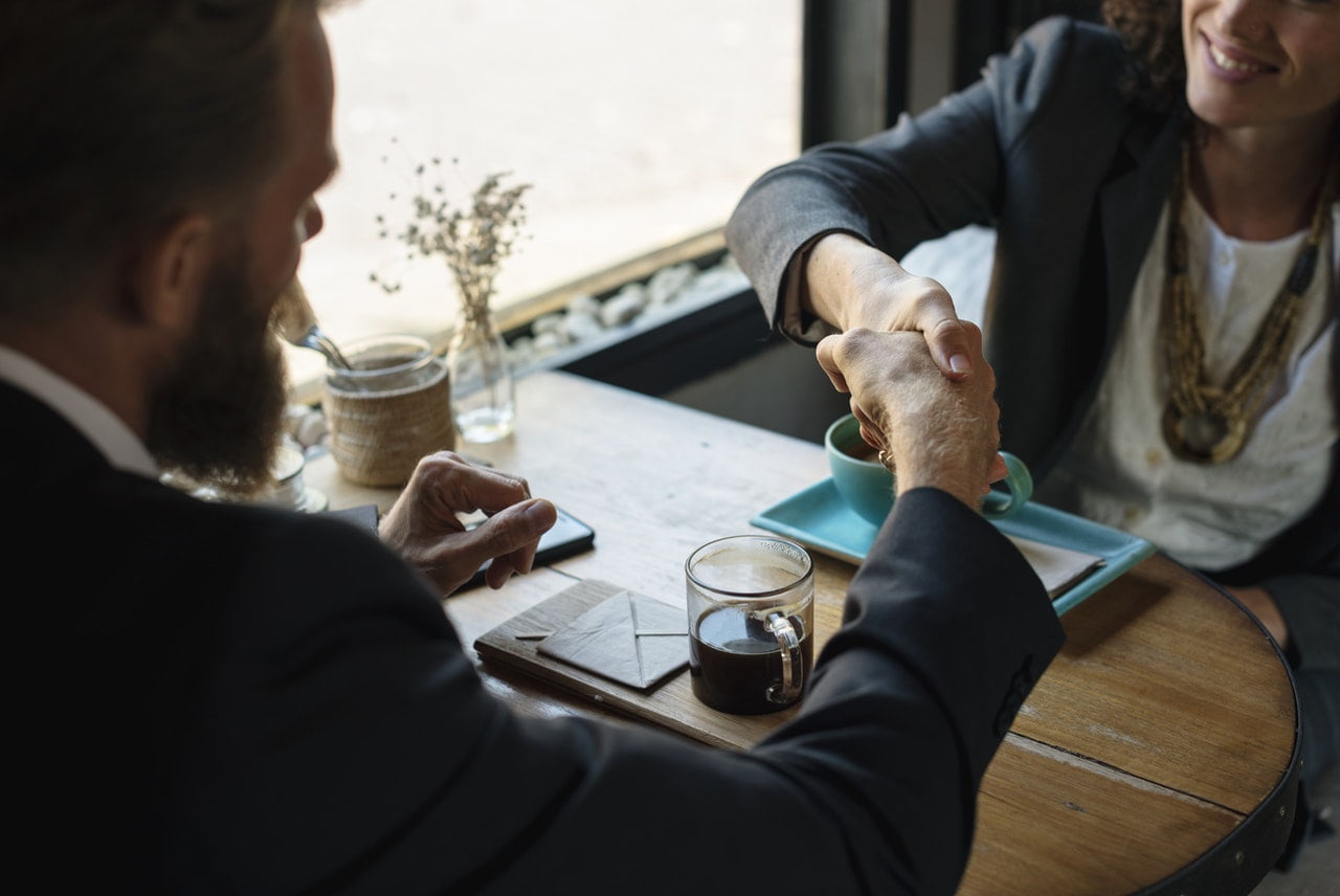 Shaking hands with Real Estate agent
