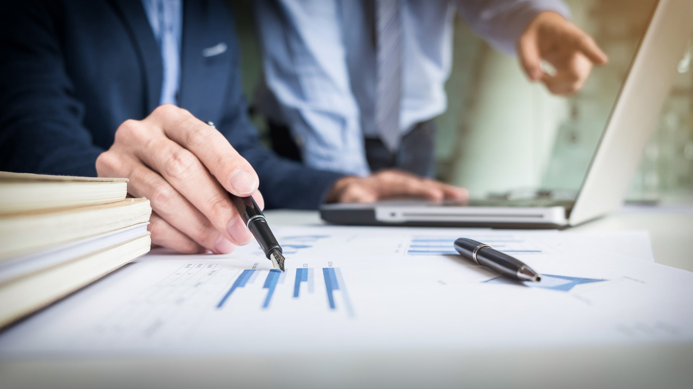 Real estate agent looking over charts