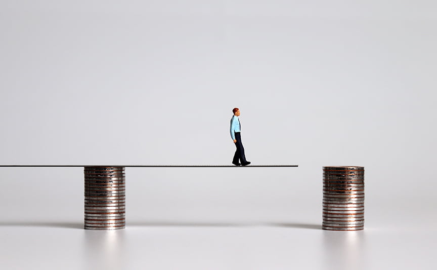 Man Walking on Plank Supported by Coins